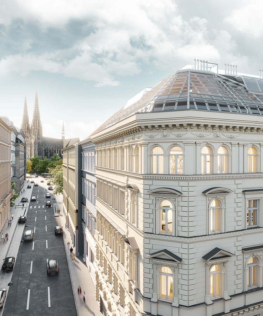 Luftaufnahme einer Straße in einer europäischen Stadt mit klassischer Architektur und einem entfernten Domturm.